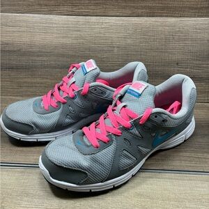 Nike Women's Gray Sneakers with Pink Accents
